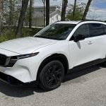 2026 Mazda CX-5 S Premium Plus, front 3/4 view, sunny day, black wheels,
