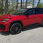 2026 Toyota RAV4 GR Sport, front 3/4 view, red, black wheels,