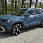 2026 Volkswagen Tiguan SEL R-Line Turbo, front 3/4 view, blue, sunny day, woods,