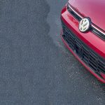 2026 Volkswagen GTI Autobahn in Kings Red, grille detail, VW Badge,