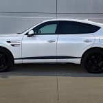 2026 GV80 Coupe Black in Uyuni White, profile, sunset, lights on,