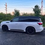 2026 Infiniti QX80 in Radiant White, profile, sunset,