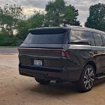 2026 Lincoln Navigator Reserve in Starlight Gray, rear 3/4 view, sunset,
