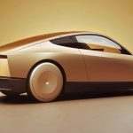 Tesla Cybercab in Gleaming Gold, rear 3/4 view, low angle,