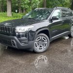 2026 Jeep Cherokee Laredo in Diamond Black Crystal, front 3/4 view,