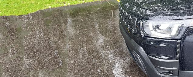 2026 Jeep Cherokee Laredo in Diamond Black Crystal, front clip, rain, headlights on,