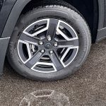 2026 Jeep Cherokee Laredo in Diamond Black Crystal, wheels, reflection in rain,
