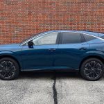 2026 Nissan Murano Platinum in Aurora Blue Pearl, profile view, red wall,
