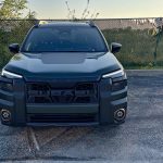 front end, dusk, 2026 Subaru Outback Wilderness in Deep Emerald Green Pearl