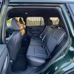 Interior, rear-seat space, rear seat, doors open, 2026 Subaru Outback Wilderness in Deep Emerald Green Pearl