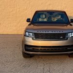 2026 Land Rover Range Rover SE in Batumi Gold, front end, grille, magic hour, sunset,
