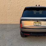 2026 Land Rover Range Rover SE in Batumi Gold, rear view, sunset,