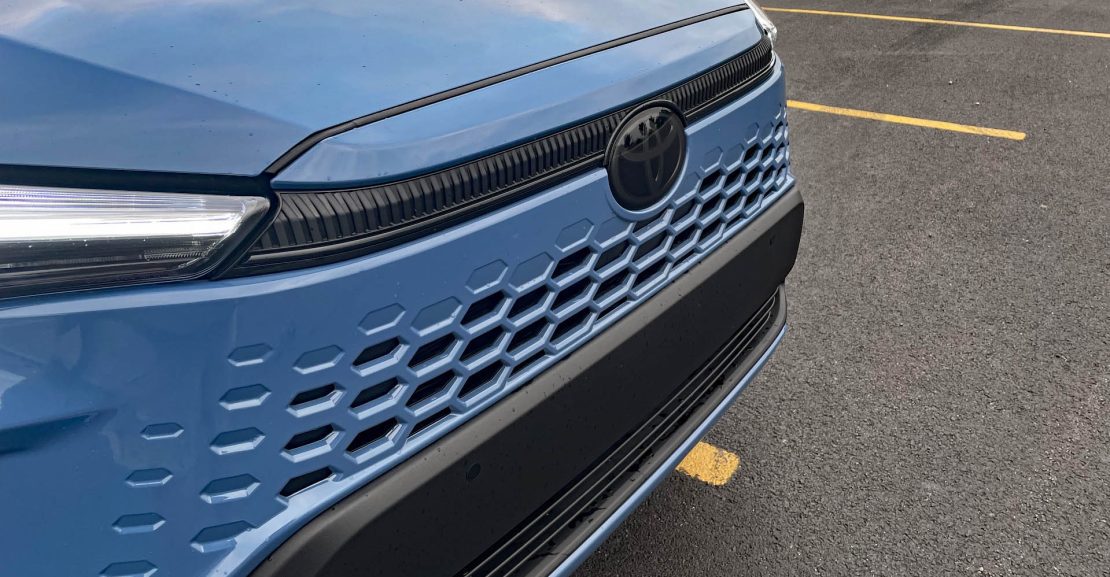 2026 Toyota Corolla Cross Hybrid XSE in Cavalry Blue, Rolling Meadows, Front end, headlights on,