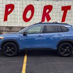 2026 Toyota Corolla Cross Hybrid XSE in Cavalry Blue, profile view, cloudy day,