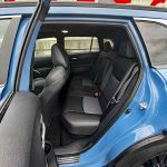 2026 Toyota 2026 Toyota Corolla Cross Hybrid XSE in Cavalry Blue, Rolling Meadows, Front end, headlights on, Hybrid XSE in Cavalry Blue, rear seats, passenger space,