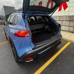 2026 Toyota 2026 Toyota Corolla Cross Hybrid XSE in Cavalry Blue, Rolling Meadows, Front end, headlights on, Hybrid XSE in Cavalry Blue, cargo area, hatch open, tailgate,