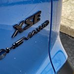 2026 Toyota 2026 Toyota Corolla Cross Hybrid XSE in Cavalry Blue, Rolling Meadows, Front end, headlights on, Hybrid XSE in Cavalry Blue, Hybrid badge,