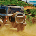 2027 Ford Bronco Filson, rear 3/4 view, in motion,