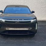 2026 Lucid Gravity Grand Touring in Supernova Bronze, front end, headlights on,