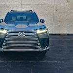 2026 Lexus LX 600 Luxury in Atomic Silver, front end, headlights on,