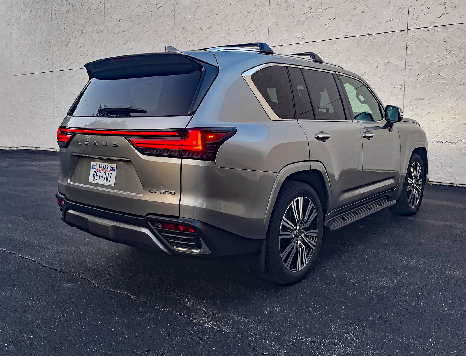 2026 Lexus LX 600 Luxury in Atomic Silver, rear 3/4 view,