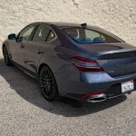 2026 Genesis G70 3.3T Prestige Graphite in Ceres Blue, rear 3/4 view,