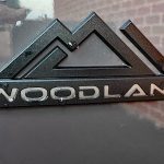 2026 Toyota RAV4 Woodland PHEV in Urban Rock, woodland badge,