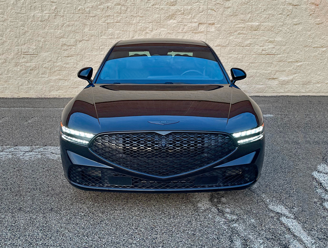2026 Genesis G90 Prestige Black, front view, headlights on,