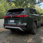 2027 Volkswagen Atlas SE, rear 3/4 view, woods,