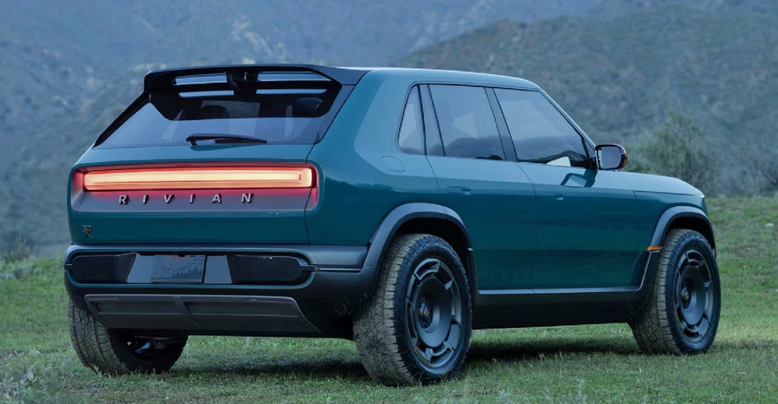 Rivian R3X Concept, rear 3/4 view, taillights on, dusk, misty,