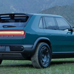 Rivian R3X Concept, rear 3/4 view, taillights on, dusk, misty,