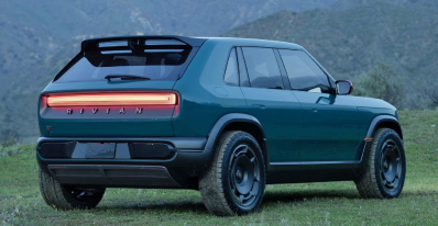 Rivian R3X Concept, rear 3/4 view, taillights on, dusk, misty,